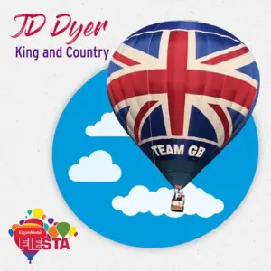 A hot air balloon with a Union Jack design floats among clouds, part of the ExxonMobil Fiesta event.