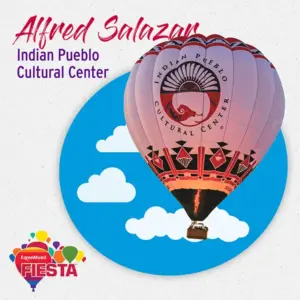 A hot air balloon featuring the Indian Pueblo Cultural Center logo floats with clouds. The design includes vibrant colors and cultural patterns.
