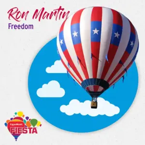 A hot air balloon with patriotic design flies in blue sky with clouds. ExxonMobil Fiesta logo and text
