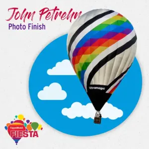 Colorful hot air balloon with spiral design on light background. Text reads