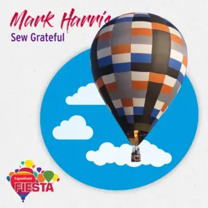 A colorful hot air balloon against a sky with clouds, featuring