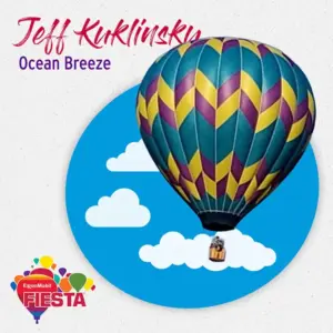 A colorful hot air balloon with geometric patterns against a blue sky backdrop, promoting the ExxonMobil Fiesta event with clouds and logos.