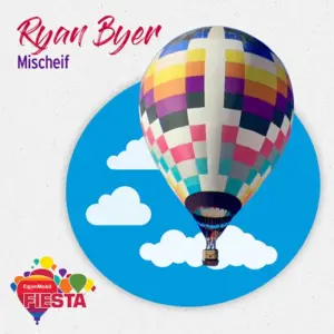 Colorful hot air balloon with checkered pattern against blue sky with clouds. ExxonMobil Fiesta logo. Text: