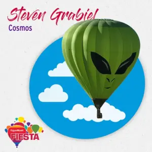 A green alien-themed hot air balloon at the ExxonMobil Fiesta event features a vibrant sky backdrop with stylized clouds.