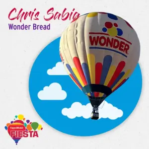A vibrant Wonder Bread hot air balloon floats against a blue sky with clouds, promoting the ExxonMobil Fiesta event.