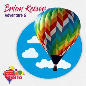 A vibrant hot air balloon floats against a blue sky with clouds.