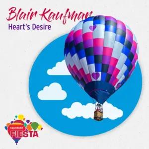 A colorful hot air balloon with heart patterns floats against a blue sky with clouds.