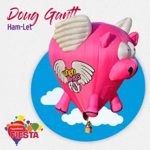 A pink pig-shaped hot air balloon with wings is floating in the sky with clouds, promoting the ExxonMobil Fiesta event.