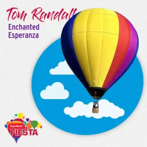 A colorful hot air balloon floats against a blue sky with clouds, designed for the ExxonMobil Fiesta. Text reads