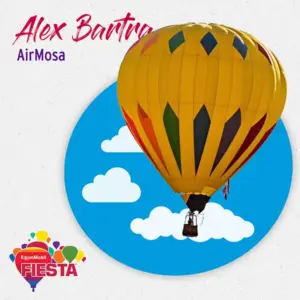 Yellow hot air balloon with colorful patterns, floating against a blue sky.