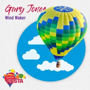 A colorful hot air balloon floats against a blue sky with clouds.