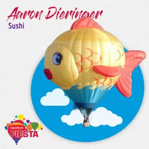 A colorful hot air balloon shaped like a fish, with clouds in the background.