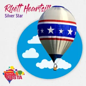 A hot air balloon with star and stripe design against a cloudy sky backdrop promotes the ExxonMobil Fiesta event.