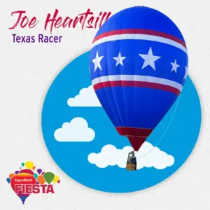 A blue hot air balloon with red and white stripes and stars flies against a cloudy sky backdrop, featuring the