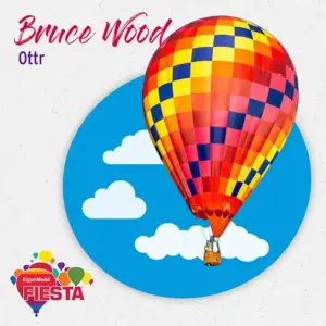 Colorful hot air balloon floats against a blue sky with clouds.