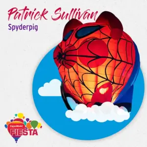 Hot air balloon resembling a superhero pig with red web design. Blue sky background, clouds, and text indicating