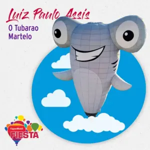 Iconic hammerhead shark hot air balloon, smiling against a blue sky with clouds.