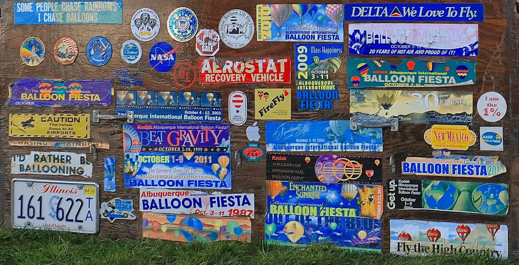 Wall covered in balloon fiesta bumper stickers