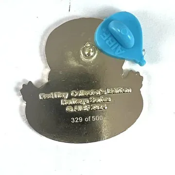 Silver collectible pin. Inscription reads "Red May Collection Edition. Limited to 500."