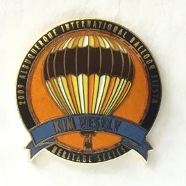 2009-Honoree-Kim-Vesely A commemorative pin for the 2009 Albuquerque International Balloon Fiesta, featuring a colorful hot air balloon design with "Kim Vesely Heritage Series" text.