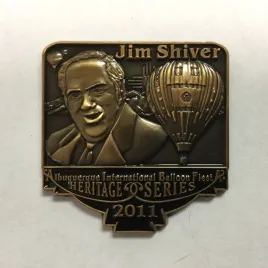 2011-Honoree-Jim-Shiver Bronze medal featuring a person, a hot air balloon, and text: "Jim Shiver Albuquerque International Balloon Fiesta Heritage Series 2011."