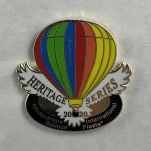 2020-Honoree-Jim-Byrd A colorful hot air balloon, labeled “Heritage Series 2020,” represents the Albuquerque International Balloon Fiesta, set against a light background.
